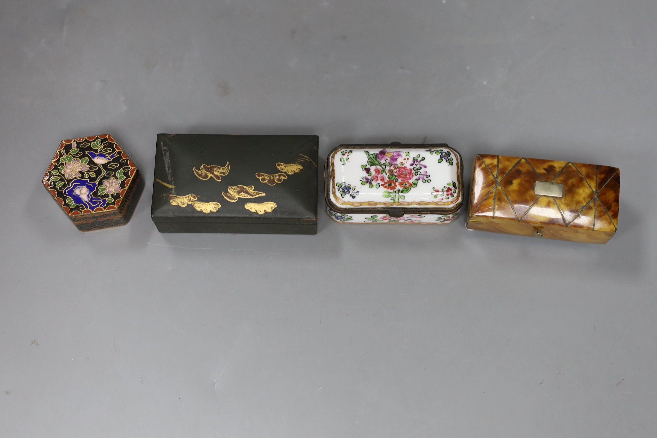 A Victorian tortoiseshell snuff box, porcelain box, enamel box and green lacquer box, largest lacquer box: 8cms high